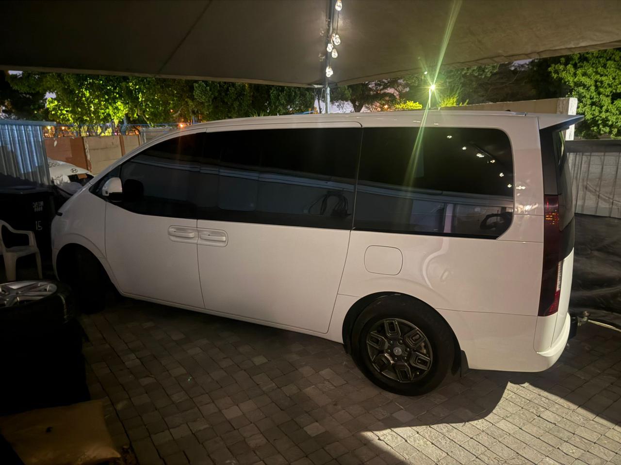 White Hyundai Staria van at night for Kasi Rides